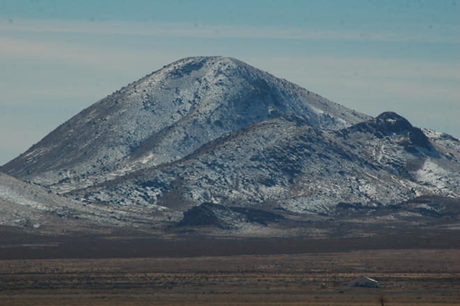 snow dust on mountains in distance, taken from Interstate 10 near the New Mexico-Arizona border